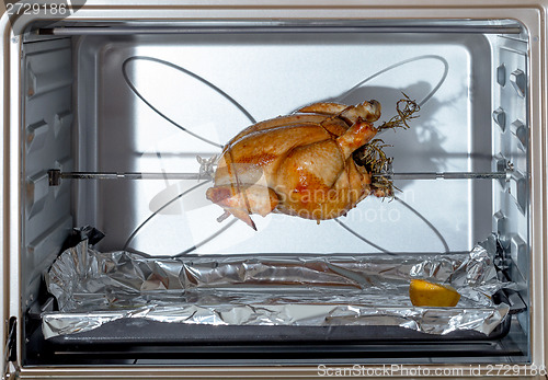 Image of Spit-roasting chicken