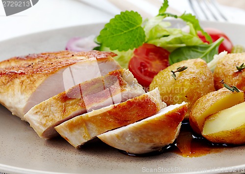 Image of roasted chicken fillet and vegetable salad