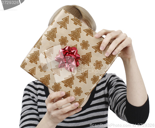 Image of Young woman holding a present