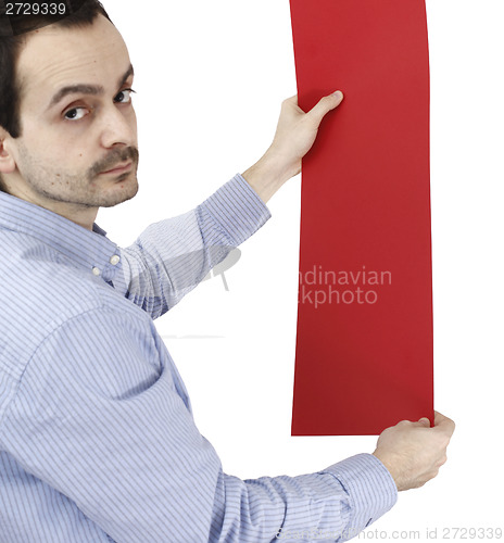 Image of Man holding a paper