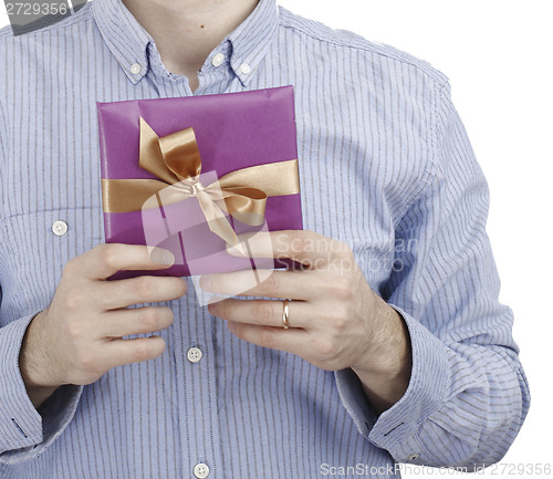 Image of Young man holding a present