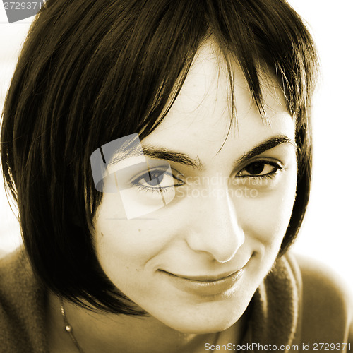 Image of Young woman in bed