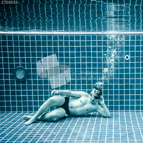 Image of Persons lies under water in a swimming pool