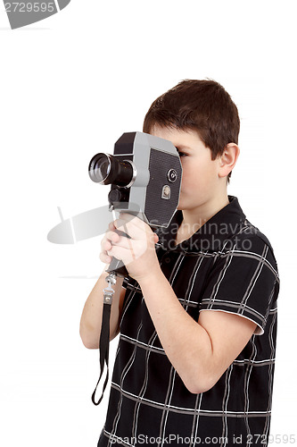 Image of young boy with old vintage analog 8mm camera