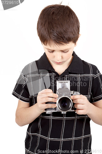 Image of young boy with old vintage analog SLR camera