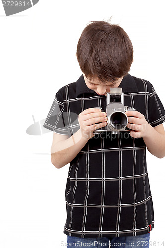 Image of young boy with old vintage analog SLR camera