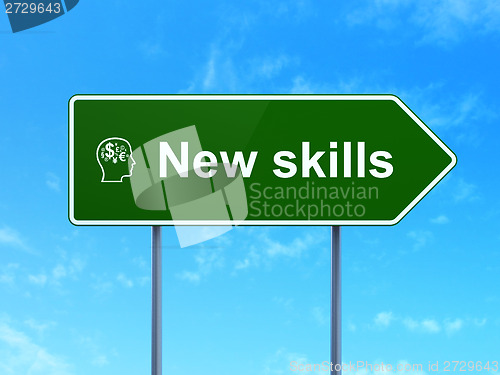 Image of Education concept: New Skills and Head With Finance Symbol on road sign background