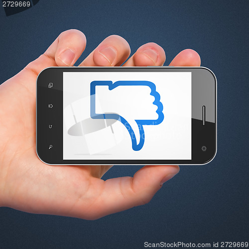 Image of Social network concept: Thumb Down on smartphone