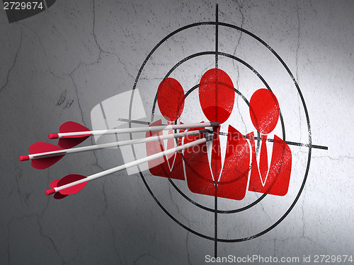 Image of Business concept: arrows in Business People target on wall background