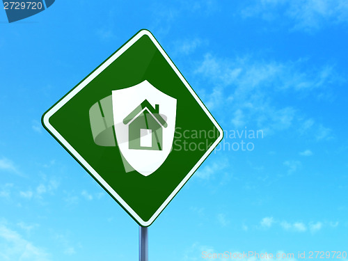 Image of Safety concept: Shield on road sign background