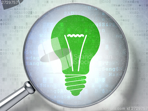 Image of Finance concept: Light Bulb with optical glass on digital background