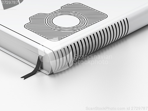 Image of Tourism concept: closed book, Photo Camera on white background