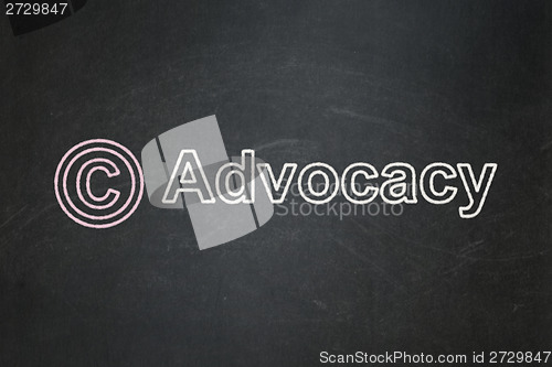 Image of Law concept: Copyright and Advocacy on chalkboard background