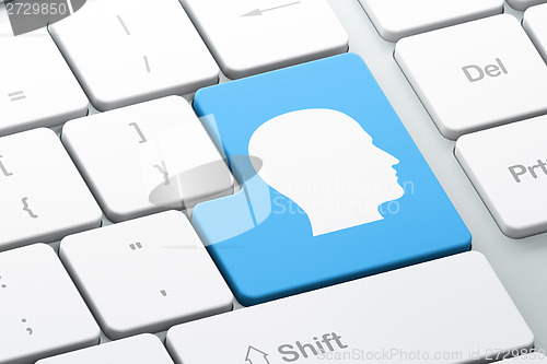 Image of Advertising concept: Head on computer keyboard background