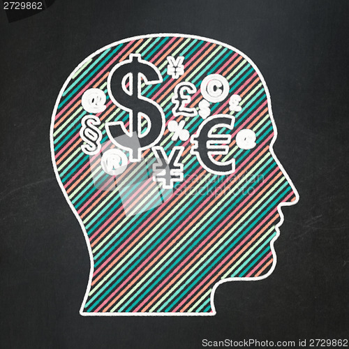 Image of Education concept: Head With Finance Symbol on chalkboard background