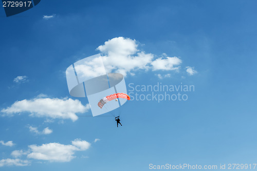 Image of unidentified skydiver on blue sky