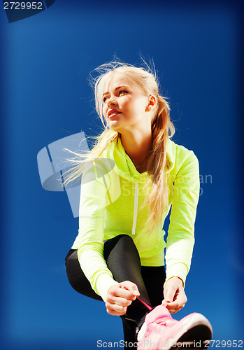 Image of woman doing sports outdoors