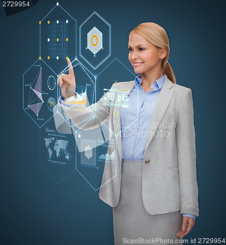 Image of smiling businesswoman working with virtual screen