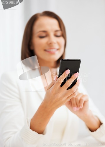 Image of smiling businesswoman or student with smartphone