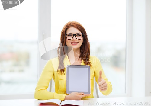 Image of smiling student girl in eyelgasses with tablet pc