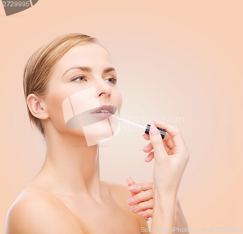 Image of beautiful woman with lipgloss