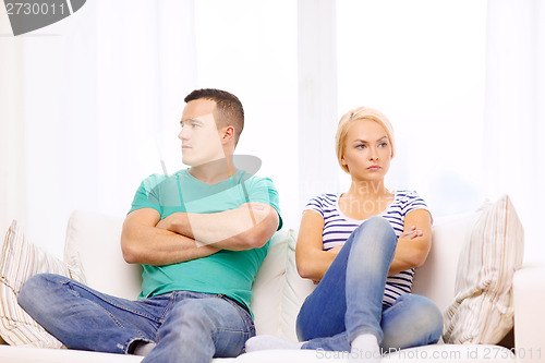 Image of unhappy couple having argument at home