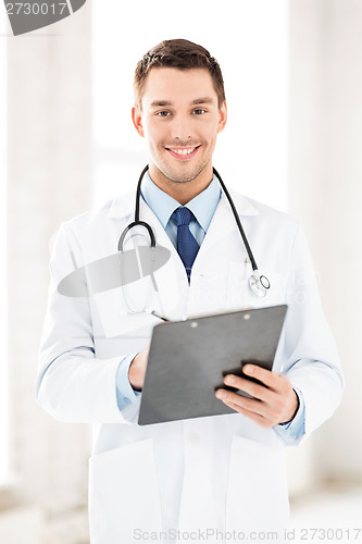 Image of male doctor writing prescription