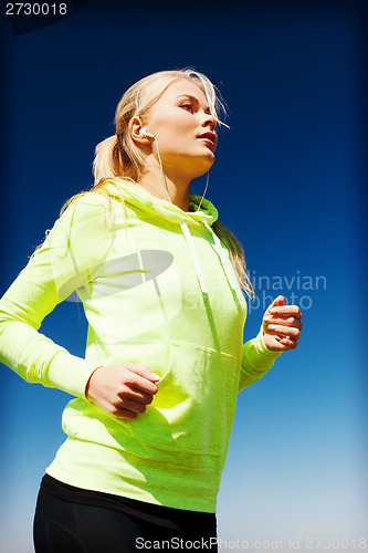 Image of woman doing running outdoors
