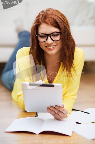 Image of student with tablet pc computer and notebooks