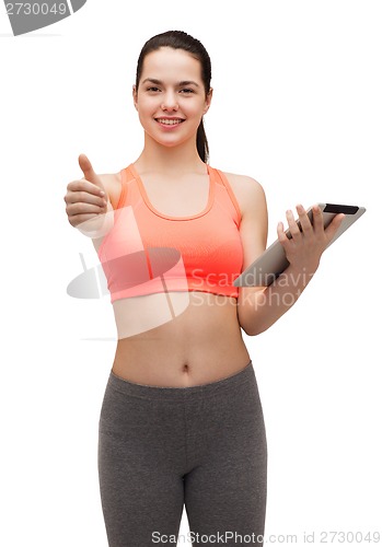 Image of sporty woman with tablet pc computer