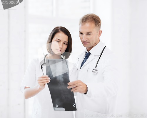 Image of two doctors looking at x-ray