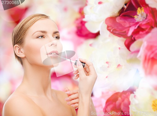 Image of beautiful woman with lipgloss