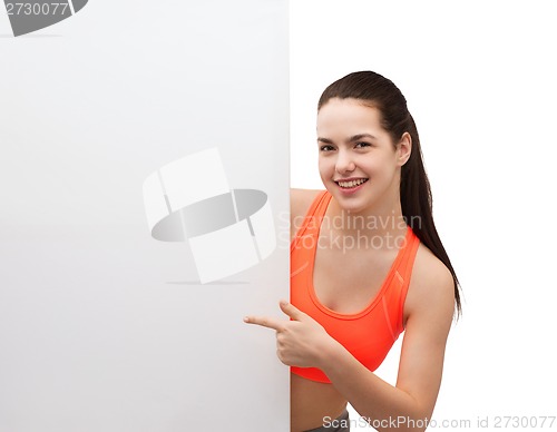 Image of teenage girl in sportswear with white board