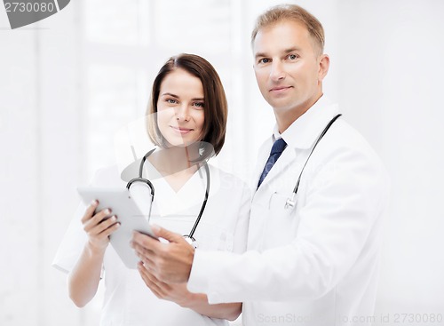 Image of two doctors looking at tablet pc