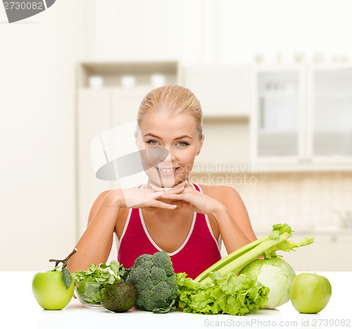 Image of smiling sporty woman with organic food