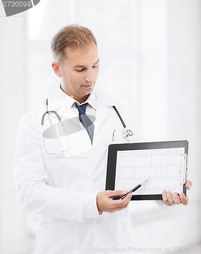 Image of male doctor with stethoscope showing cardiogram