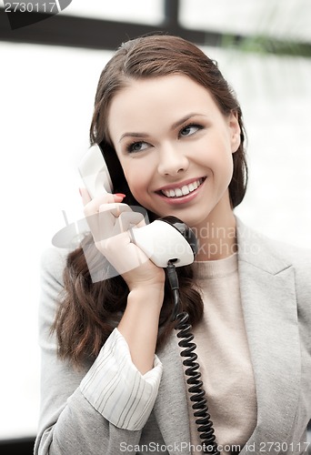 Image of businesswoman with cell phone calling