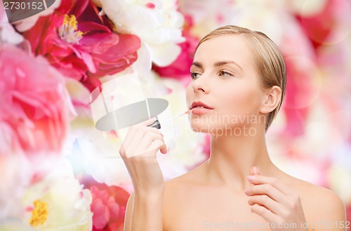 Image of beautiful woman with lipgloss