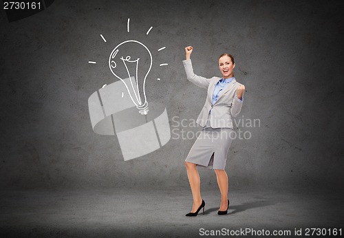 Image of happy businesswoman with hands up