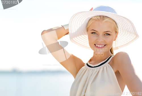 Image of beautiful woman enjoying summer outdoors