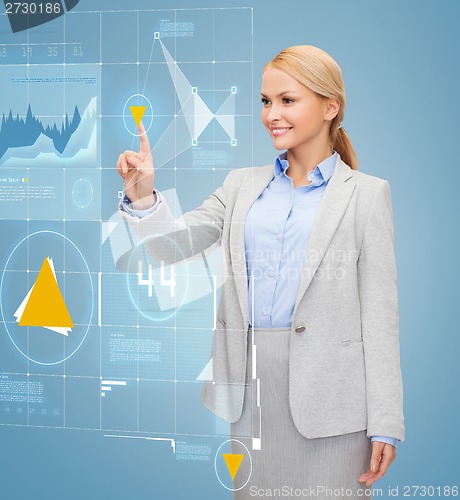 Image of smiling businesswoman working with virtual screen