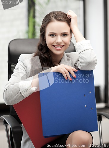 Image of beautiful smiling woman with folder