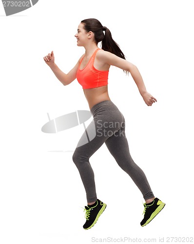 Image of sporty woman running or jumping