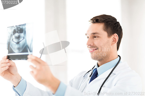 Image of male doctor or dentist with x-ray
