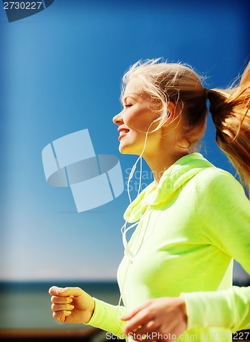 Image of woman doing running outdoors