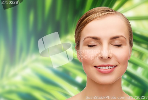 Image of face of beautiful woman with closed eyes