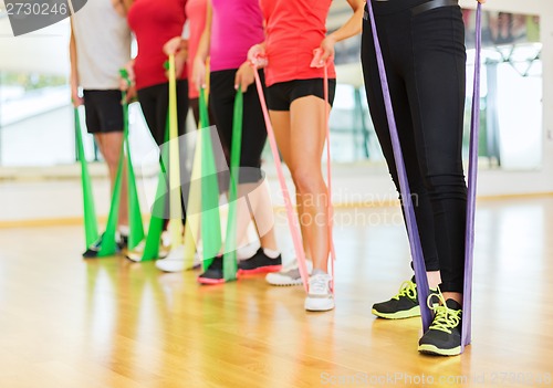 Image of group of people with working out with rubber bands