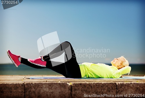 Image of woman doing sports outdoors