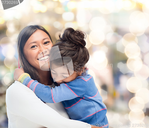 Image of hugging mother and daughter