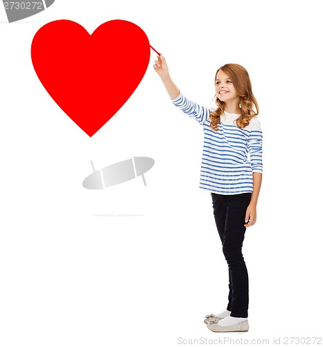 Image of girl drawing big red heart in the air